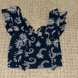 blue and white patterned crop top with ruffles
